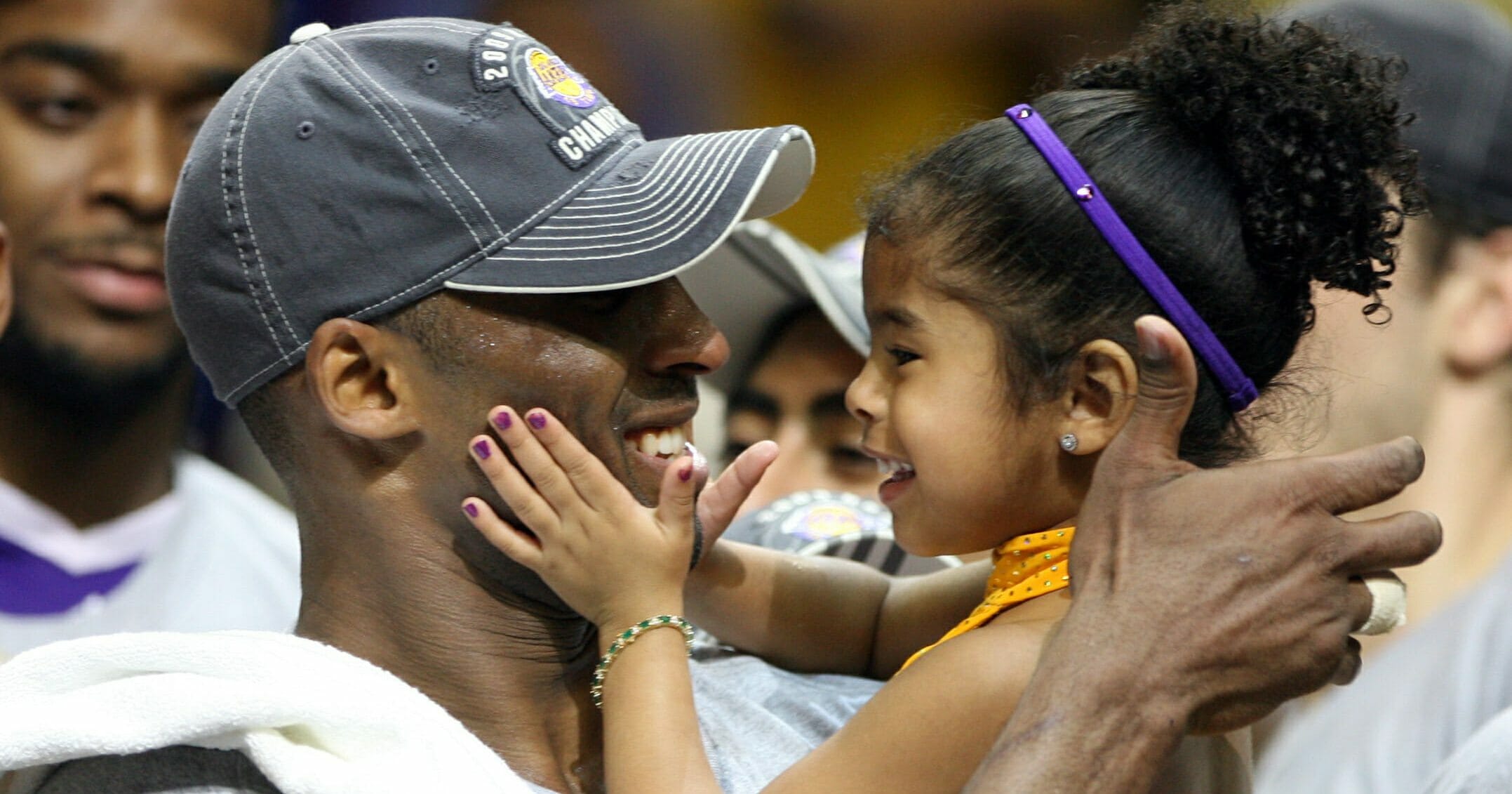 Kobe Bryant celebrates with his daughter Gianna following the Los Angeles Lakers' 99-86 defeat of the Orlando Magic in Game 5 of the NBA Finals at Amway Arena in Orlando, Florida, on June 14, 2009.