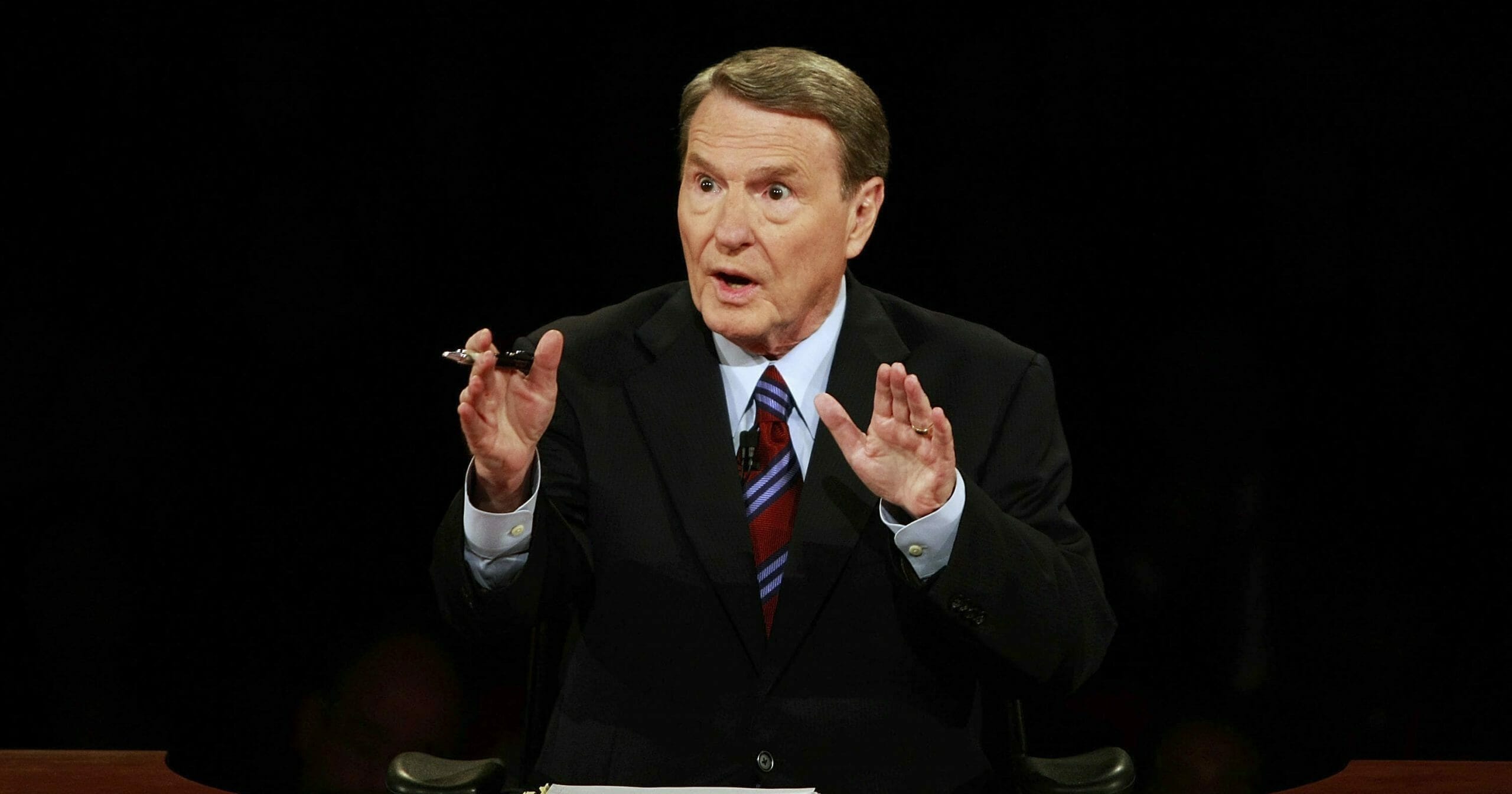 This Sept. 26, 2008, file photo shows debate moderator Jim Lehrer during the first U.S. presidential debate between presidential nominees then-Sen. John McCain (R-Arizona), and then-Sen. Barack Obama (D-Illinois) at the University of Mississippi in Oxford, Mississippi. PBS announced that PBS NewsHour's Jim Lehrer died Jan. 23, 2020, at home. He was 85.