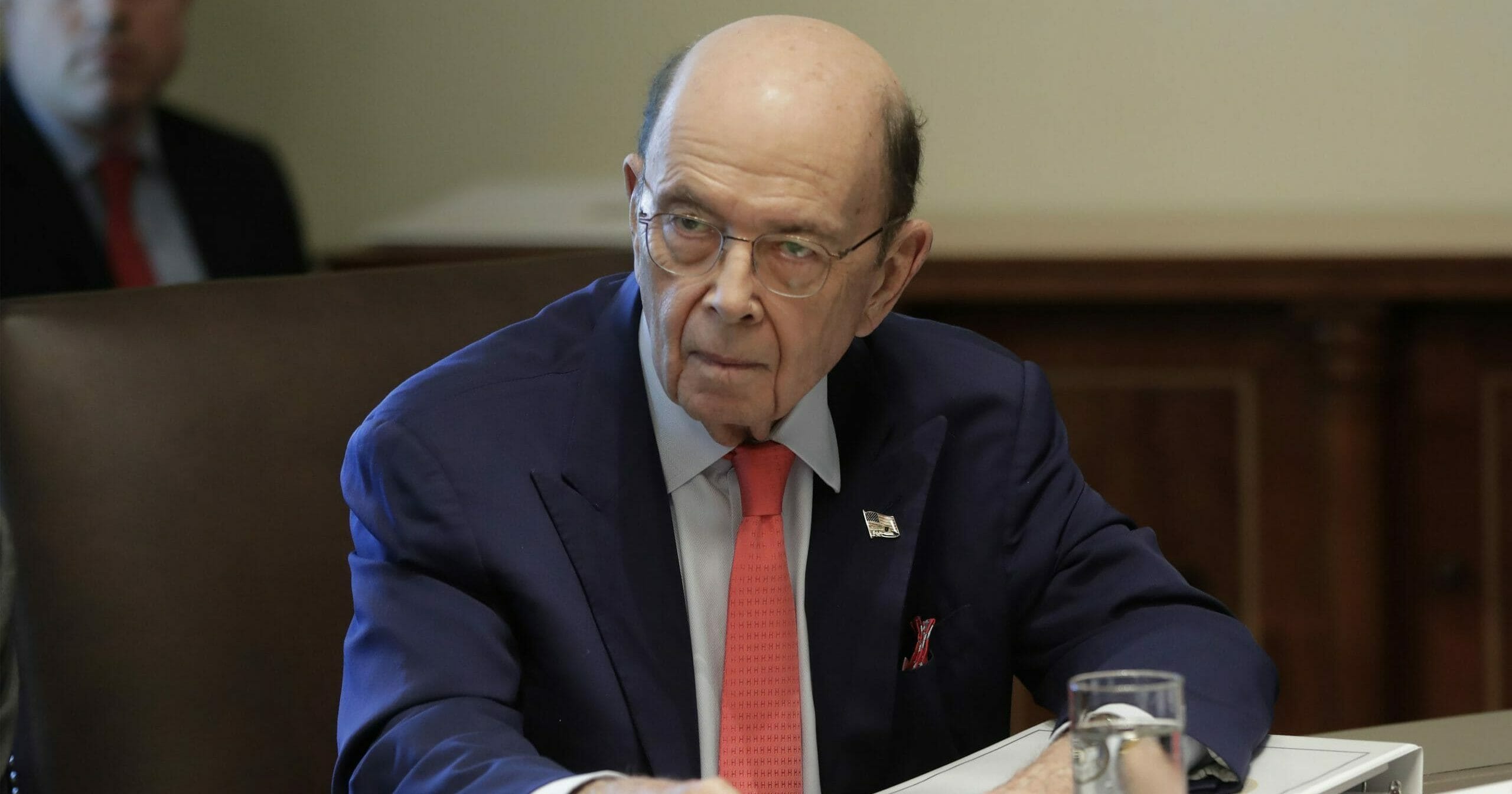 In this Oct. 21, 2019, file photo, Commerce Secretary Wilbur Ross listens to President Donald Trump speak during a Cabinet meeting in the Cabinet Room of the White House in Washington.