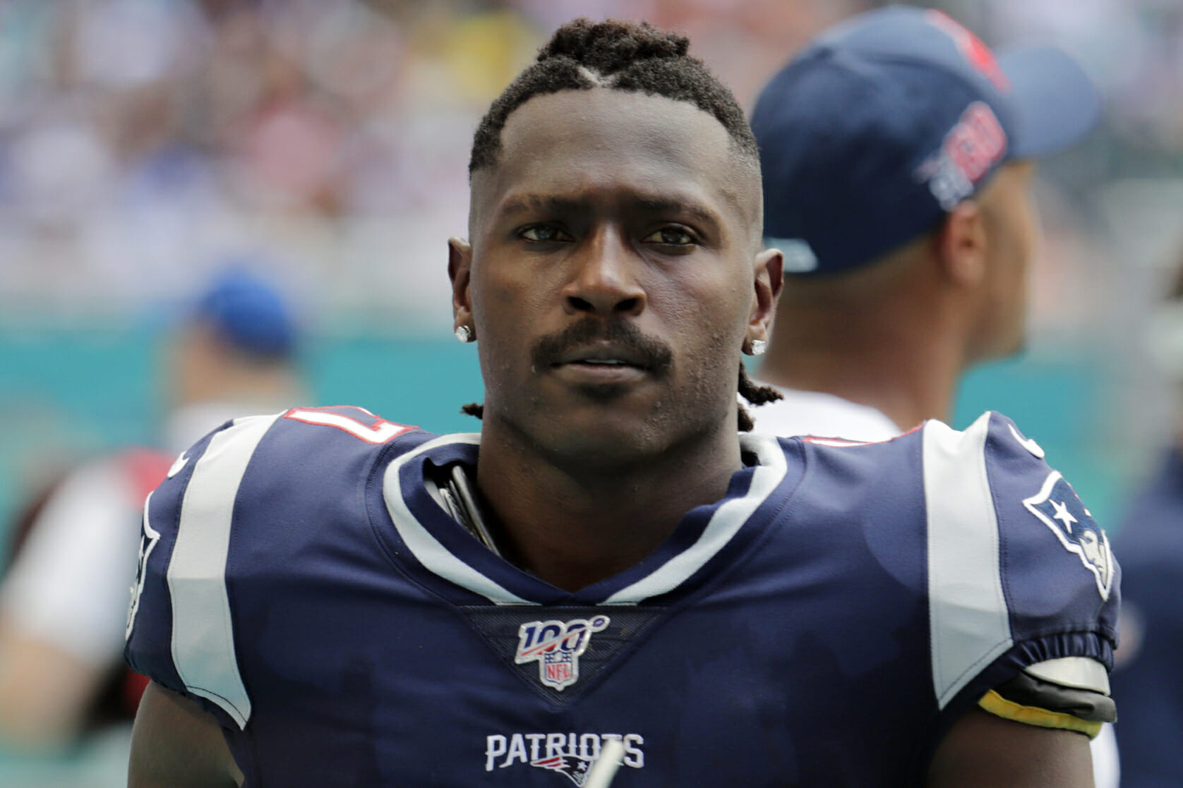 In this, Sept. 15, 2019, file photo, New England Patriots wide receiver Antonio Brown (17) is seen on the sidelines during the first half at an NFL football game against the Miami Dolphins in Miami Gardens, Florida.