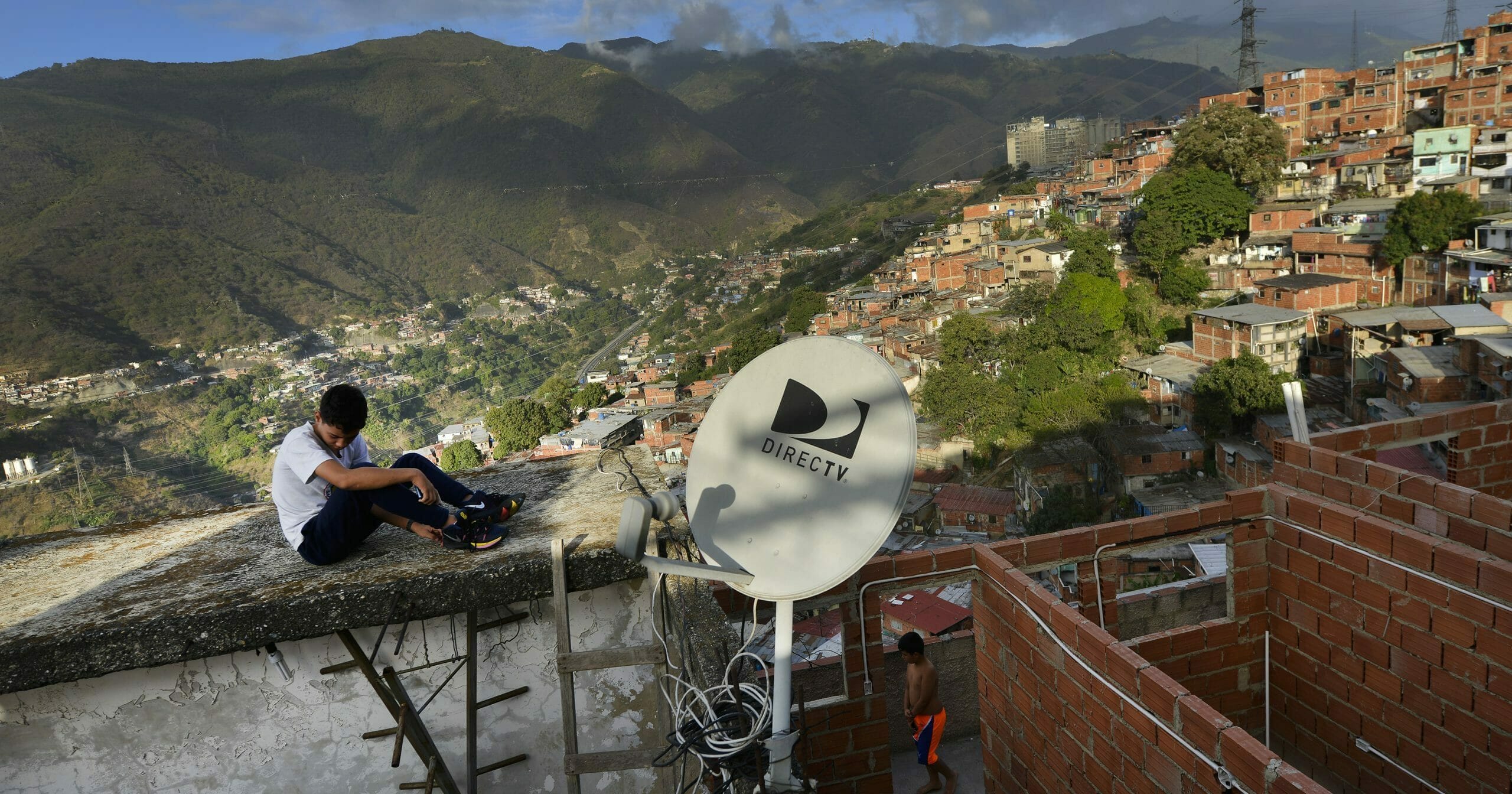 A DirectTV dish stands on home in the Catia neighborhood of Caracas, Venezuela, on Jan. 9, 2020.