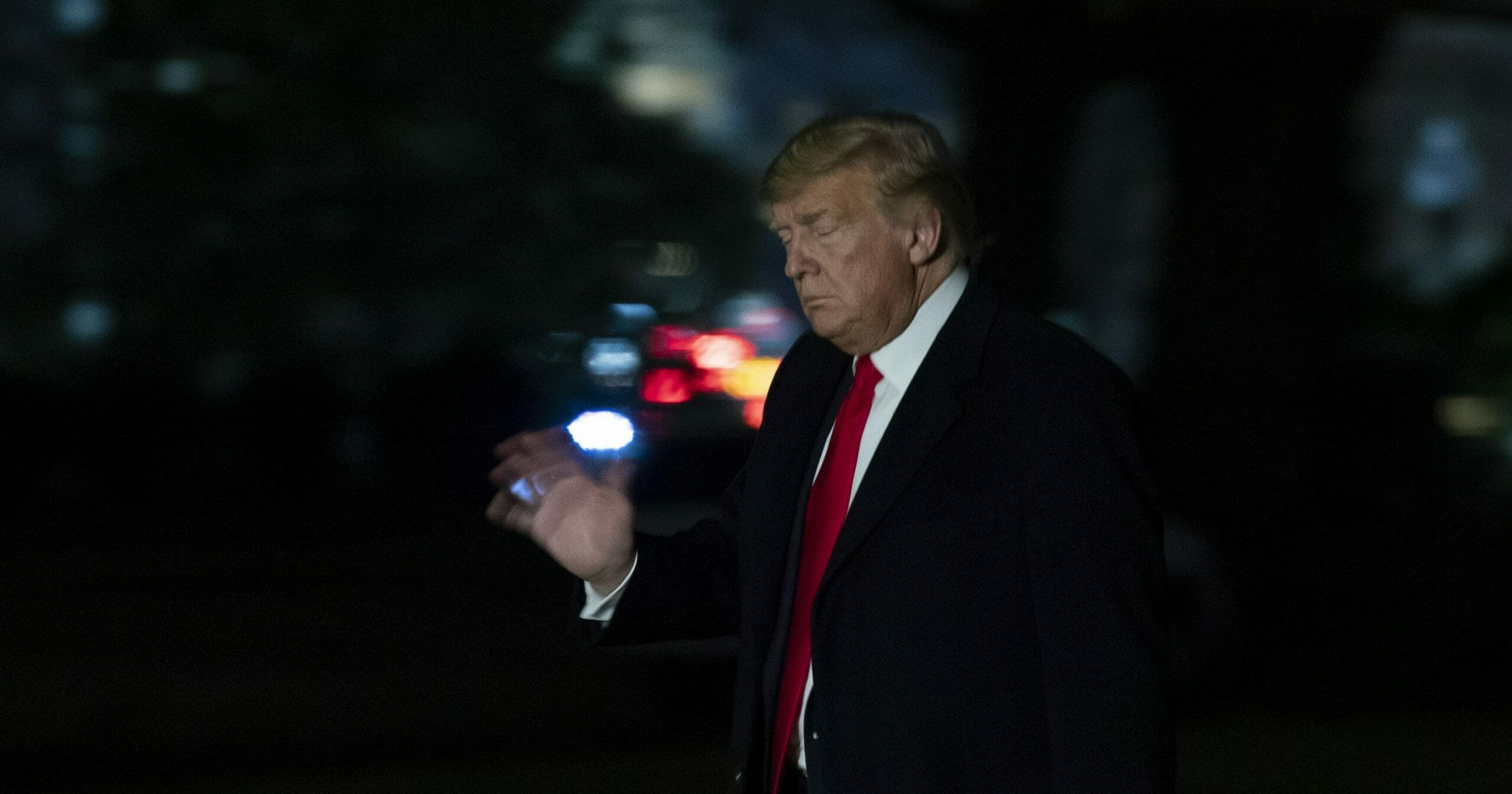 President Donald Trump waves as he walks on the South Lawn of the White House, with the U.S. Capitol in the background, after returning on Marine One on Jan. 23, 2020, in Washington, D.C.