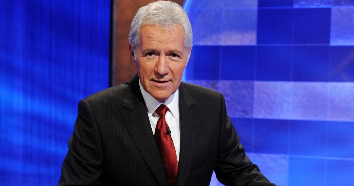 Game show host Alex Trebek poses on the set of the "Jeopardy!" Million Dollar Celebrity Invitational Tournament Show taping on April 17, 2010, in Culver City, California.