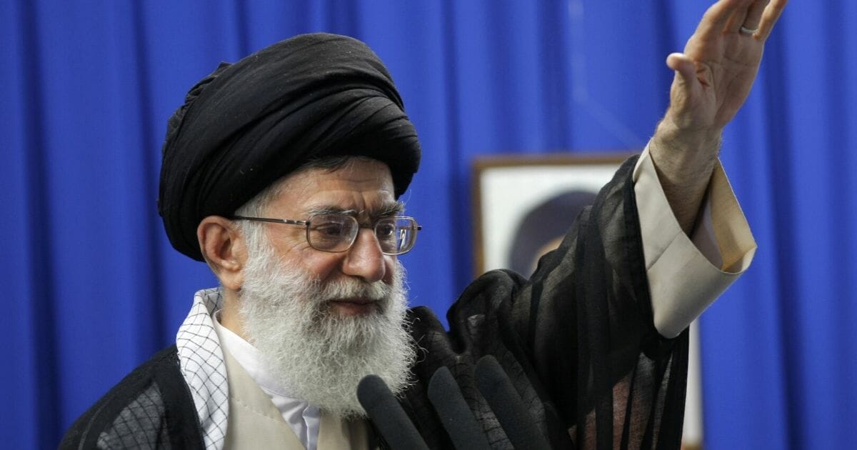 Iranian Supreme Leader Ayatollah Ali Khamenei gestures as he addresses the faithful at the weekly Muslim Friday prayers at Tehran University on June 19, 2009.