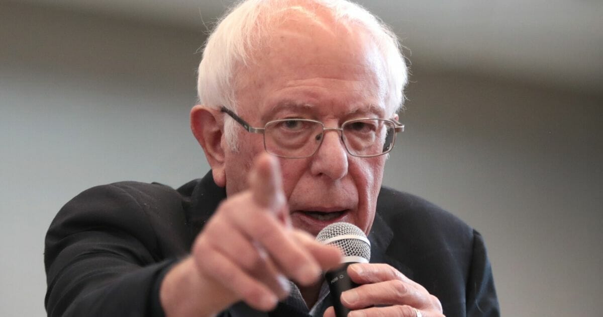 Democratic presidential candidate Sen. Bernie Sanders of Vermont points during a campaign stop at Berg Middle School in Newton, Iowa, on Jan. 11, 2020.