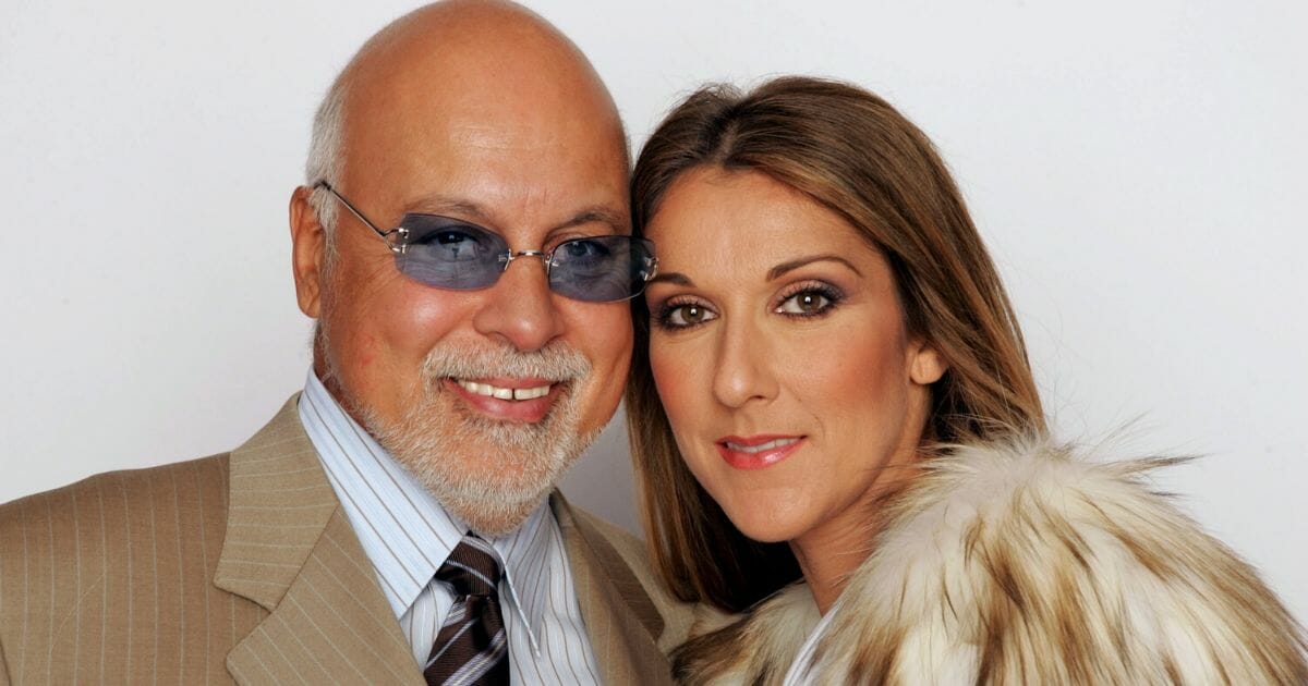 Celine Dion and her husband Rene Angelil pose for a picture backstage during the 2004 World Music Awards at the Thomas and Mack Center on Sept. 15, 2004, in Las Vegas, Nevada.