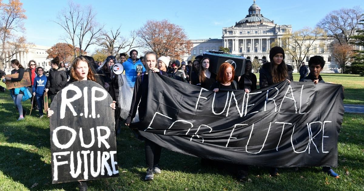 Young activists take part in a rally to protest against climate change outside the U.S. Capitol in Washington, D.C., on Nov. 29, 2019.