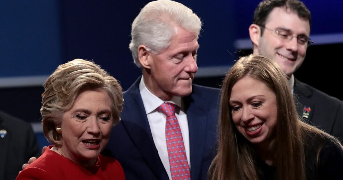 Then-Democratic presidential nominee Hillary Clinton looks on with husband and former President Bill Clinton and daughter Chelsea Clinton after the presidential debate with then-Republican presidential nominee Donald Trump at Hofstra University on Sept. 26, 2016 in Hempstead, New York.