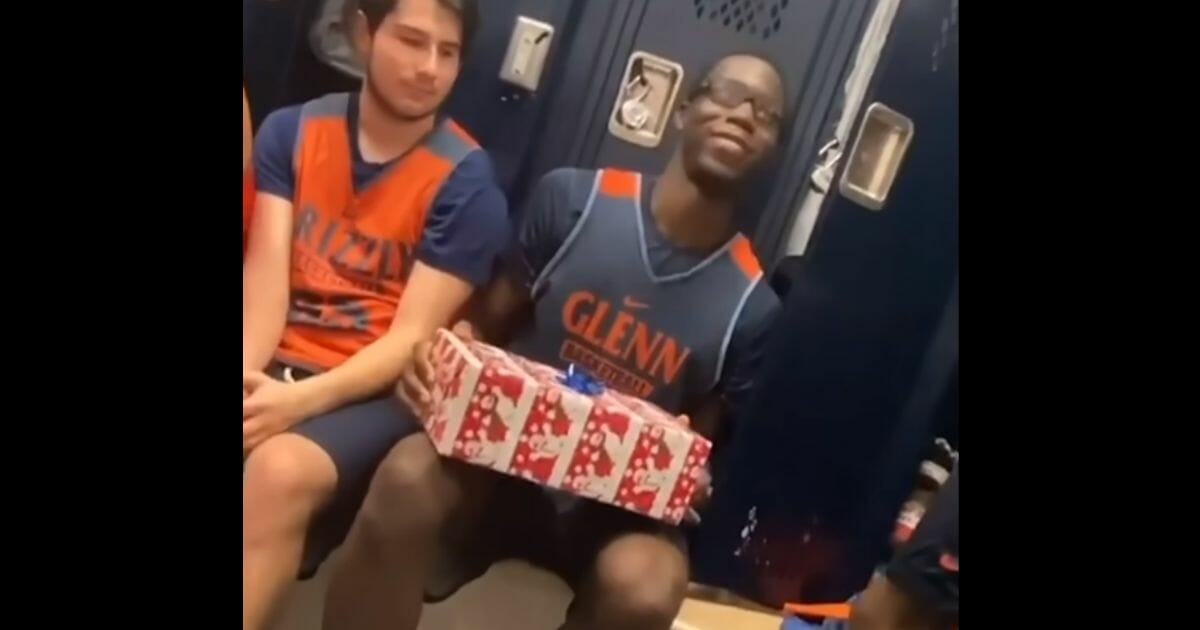 David Kra holds a present from his teammates