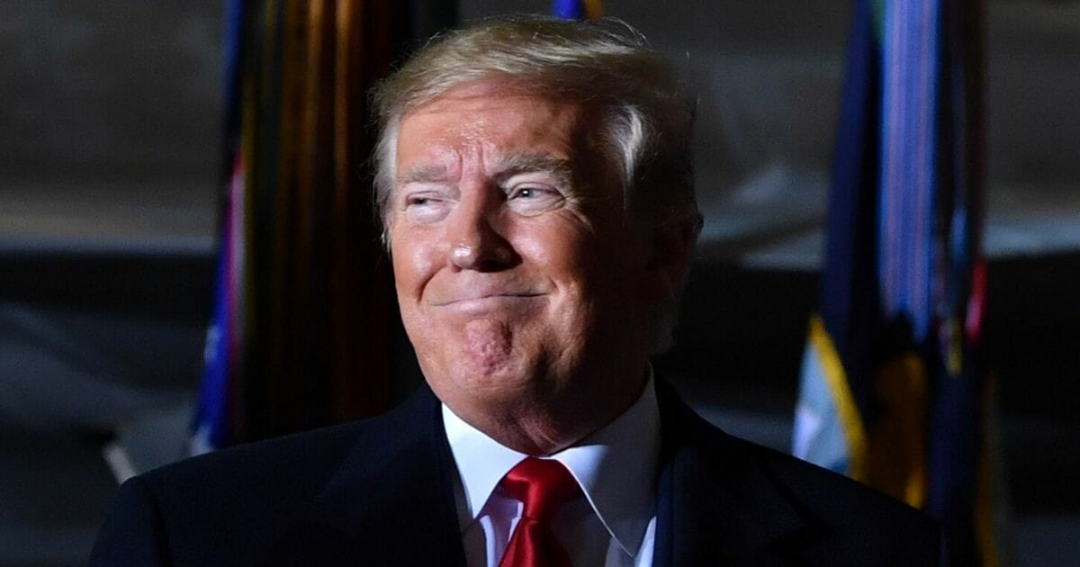 President Donald Trump looks on during a signing ceremony for the National Defense Authorization Act at Joint Base Andrews, Maryland, on Dec. 20, 2019.