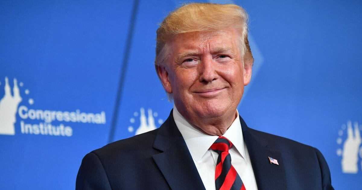 President Donald Trump smiles as he delivers remarks during the 2019 House Republican conference member retreat dinner in Baltimore, Maryland, on Sept. 12, 2019.