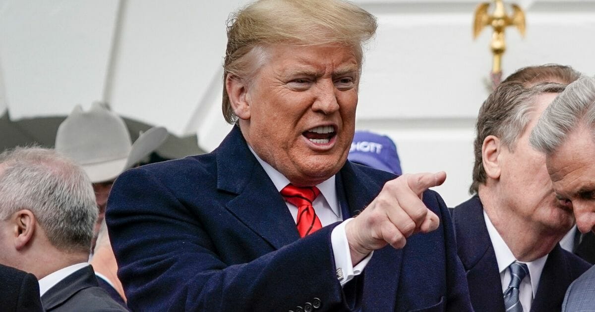 President Donald Trump gestures after signing the United States-Mexico-Canada Trade Agreement during a ceremony on the South Lawn of the White House on Jan. 29, 2020, in Washington, D.C.