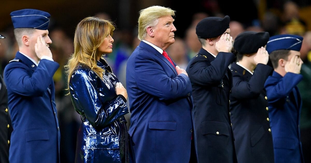 President Donald Trump and first lady Melania Trump took the field at the start of the College Football Playoff National Championship game between the LSU Tigers and the Clemson Tigers at the Mercedes Benz Superdome on Jan. 13, 2020, in New Orleans, Louisiana.