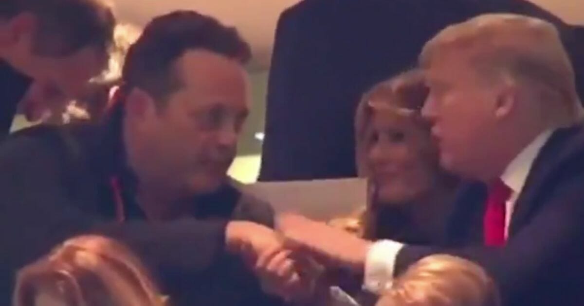 Vince Vaughn and President Donald Trump exchange words Monday during the 2020 CFP national championship game.