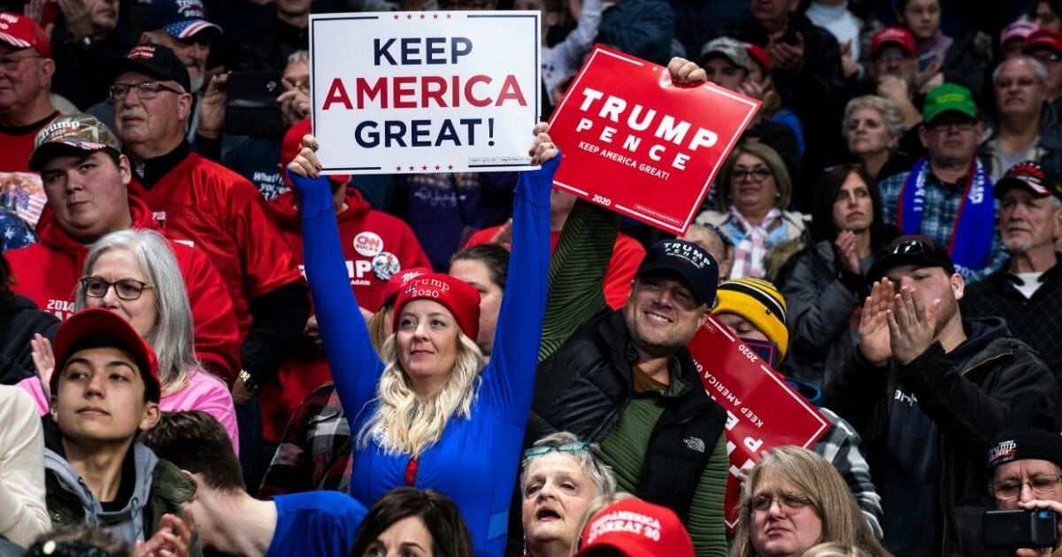 Supporters cheer in the crowd as President Donald Trump speaks at a "Keep America Great" campaign rally at the Huntington Center on Jan. 9, 2020, in Toledo, Ohio.