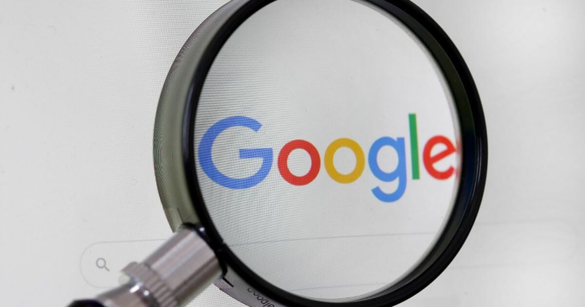 In this photo illustration, the Google logo is displayed through a magnifying glass on the screen of a computer on Sept. 10, 2019, in Paris, France.