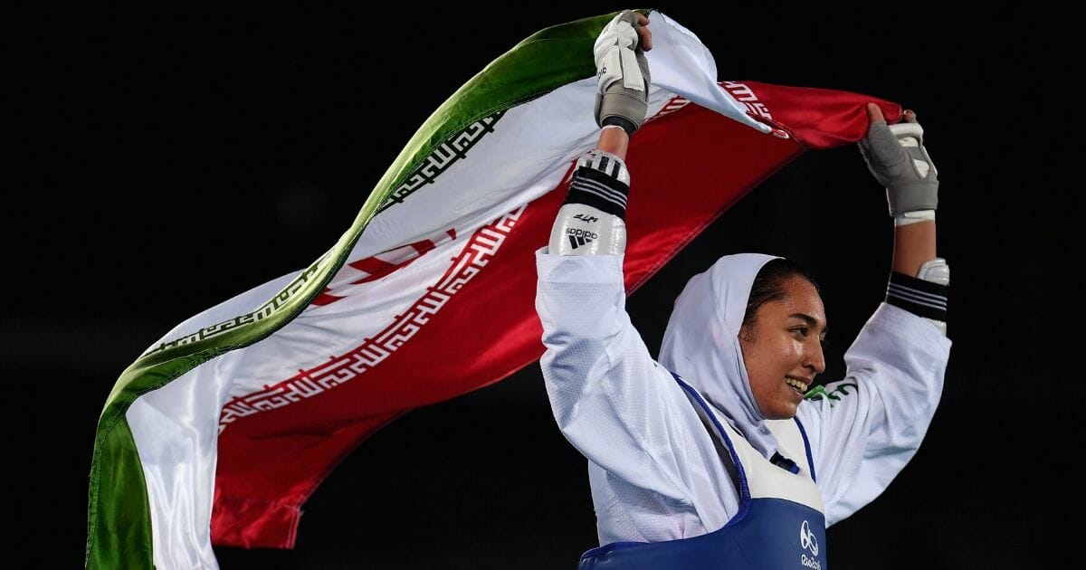 Kimia Alizadeh of Iran celebrates after defeating Nikita Glasnovic of Sweden during her bronze medal taekwondo contest Aug. 18, 2016, at the Carioca Arena in Rio de Janeiro during the 2016 Summer Olympics.