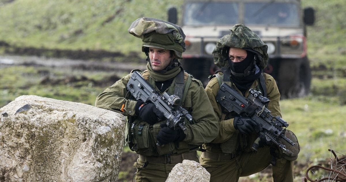 Israeli soldiers from the Golani Brigade take part in a military training exercise