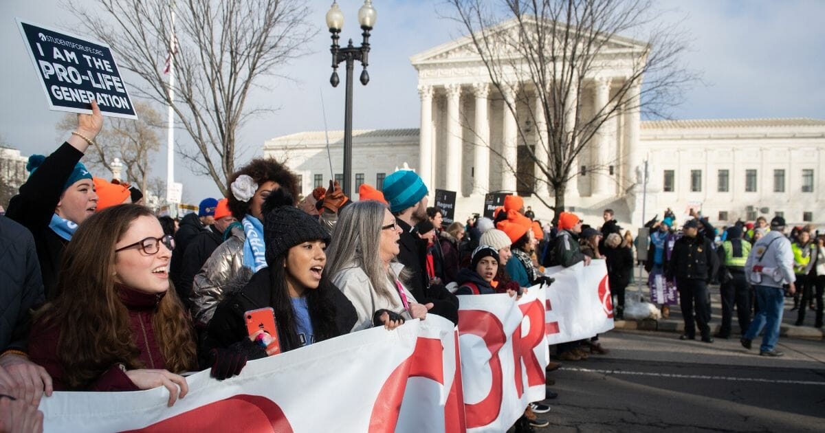 Anti-abortion activists participate in the March for Life outside the U.S. Supreme Court in Washington on Jan. 18, 2019.