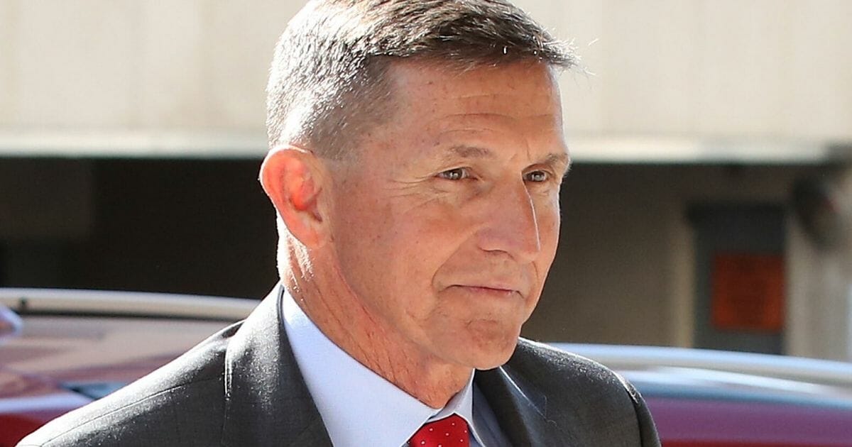 Michael Flynn, former national security adviser to President Donald Trump,arrives at the E. Barrett Prettyman Federal Courthouse in Washington for a status hearing July 10, 2018.
