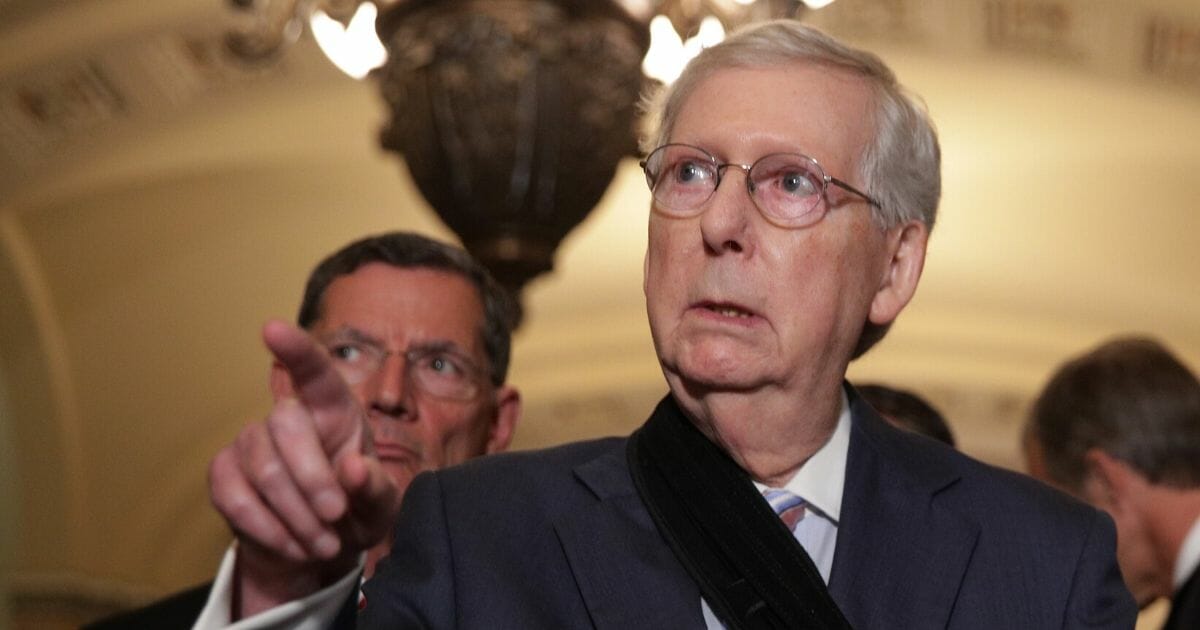 Senate Majority Leader Sen. Mitch McConnell (R-Kentucky) speaks as Sen. John Barrasso (R-Wyoming) looks on during a news briefing after the weekly Senate Republican policy luncheon on Sept 10, 2019 at the U.S. Capitol in Washington, D.C.
