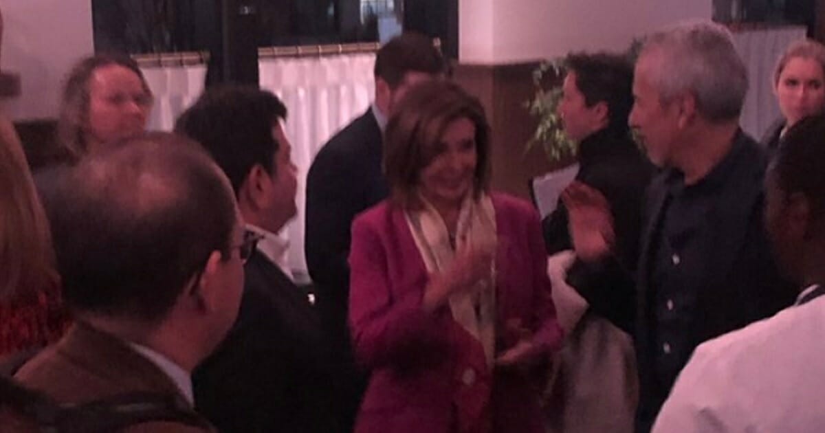 House Speaker Nancy Pelosi mingles with guests at the new Maialino Mare restaurant in Washington's Navy Yard.