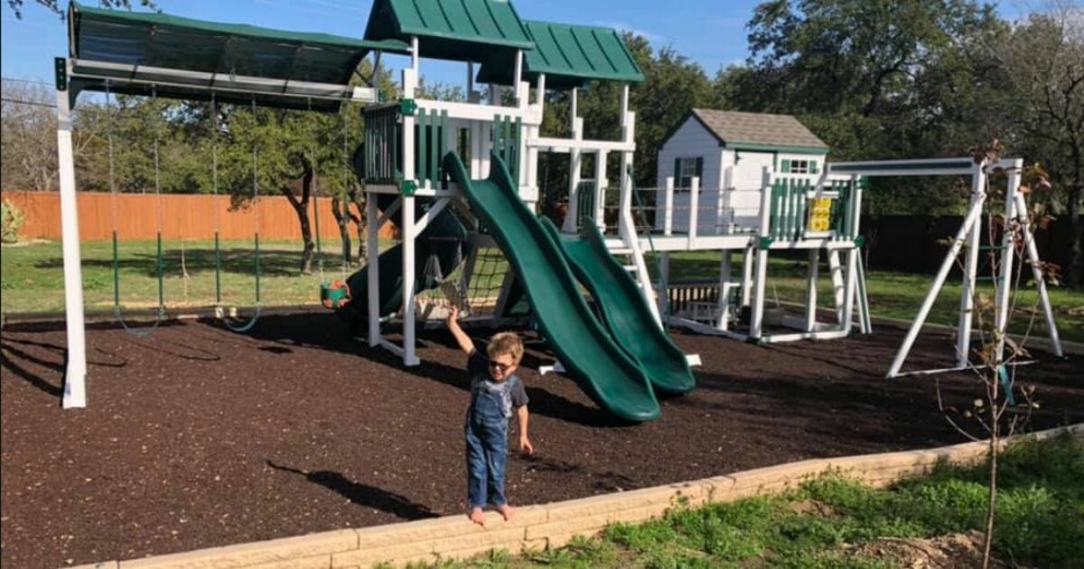 Neighbors are attempting to sue a family over a playscape they had built for their terminally ill son.