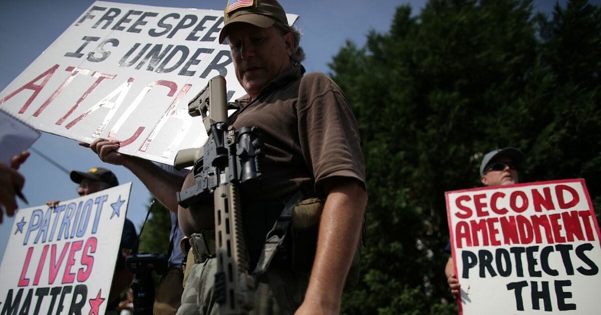 Armed gun rights activists counterprotest during a gun control rally outside the headquarters of National Rifle Association on July 14, 2017, in Fairfax, Virginia.