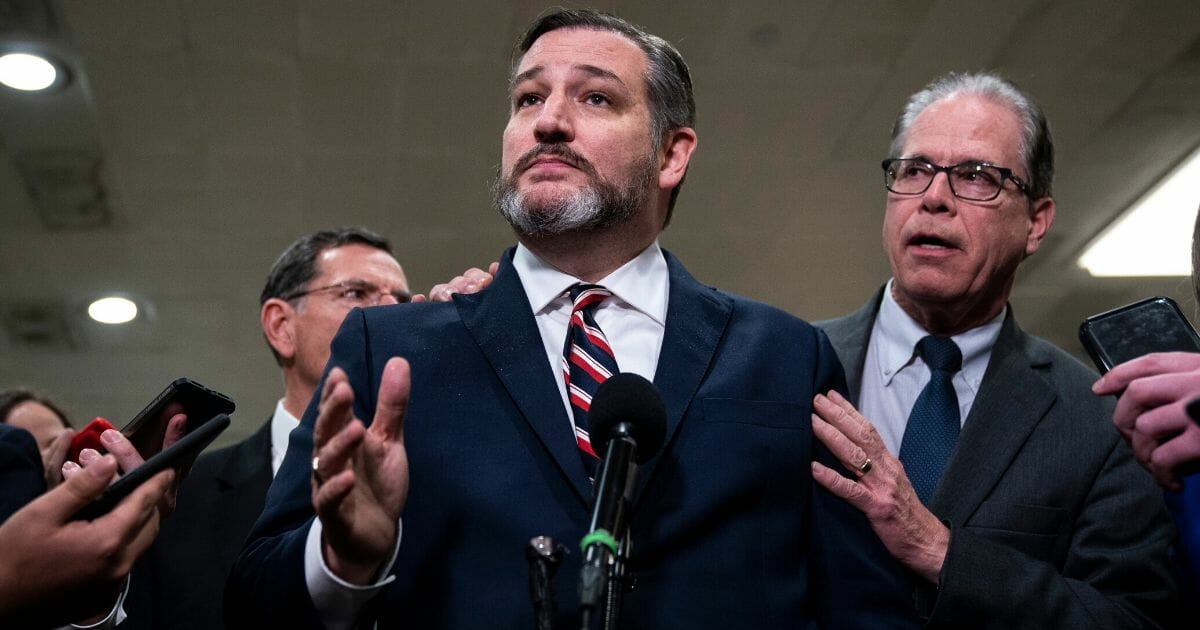 Sens. Ted Cruz (R-Texas), left, and Mike Braun (R-Indiana) speak to the media during a dinner break in the Senate impeachment trial at the U.S. Capitol on Jan. 27, 2020, in Washington, D.C.