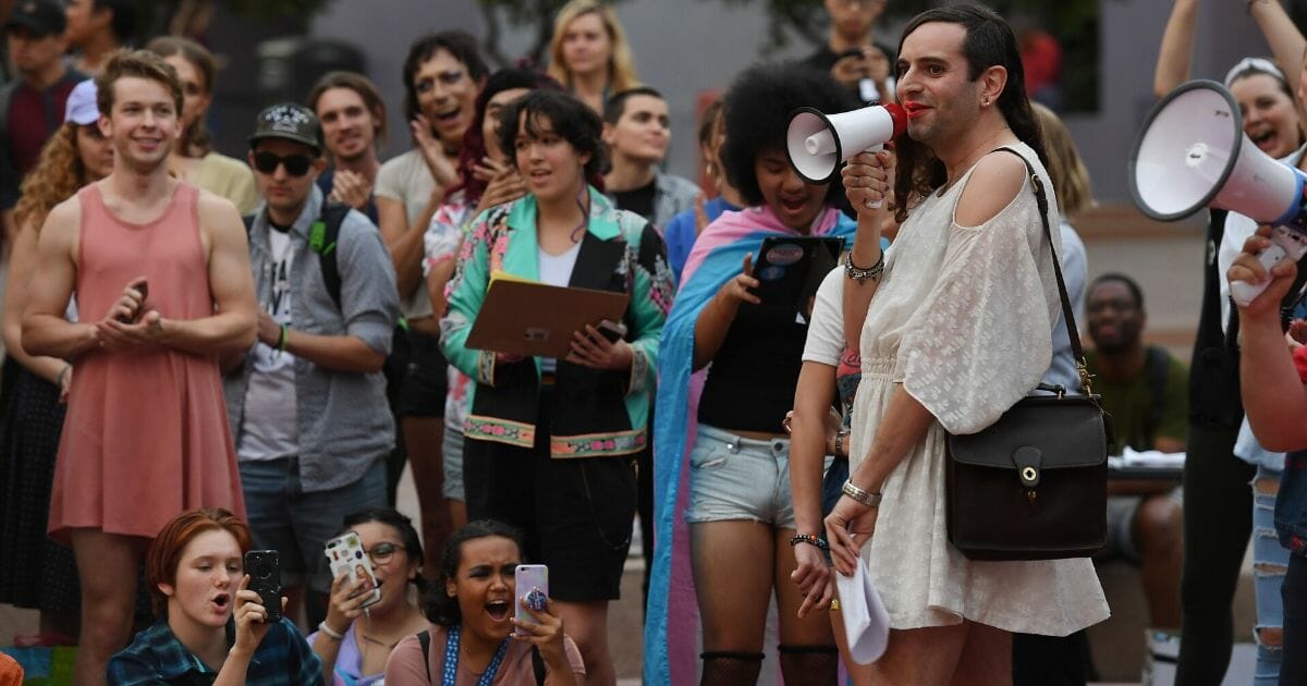 Members of the transgender community and their supporters hold a rally and march to city hall before the midterm elections to protest in Los Angeles, California, on Nov. 2, 2018.