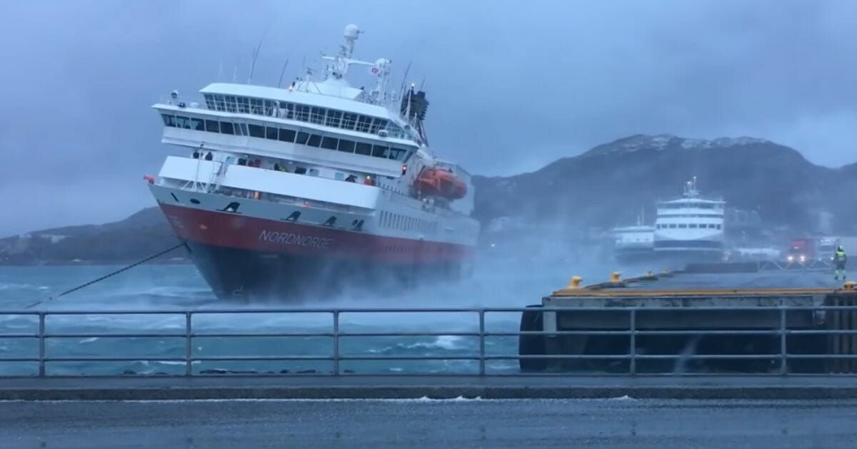 A Norwegian ship facing rough waters.