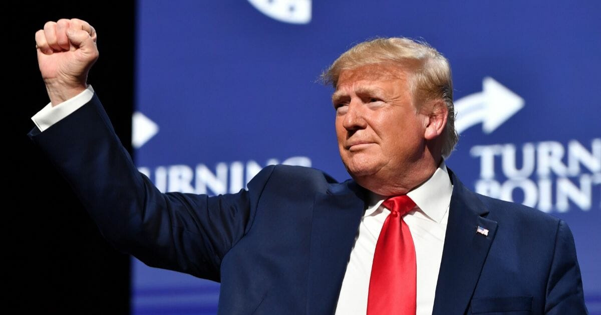 President Donald Trump gestures during the Turning Point USA Student Action Summit at the Palm Beach County Convention Center in West Palm Beach, Florida, on Dec. 21, 2019.