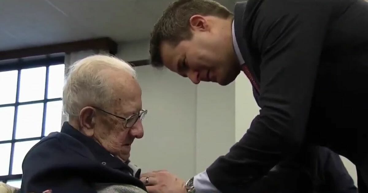 WWII Veteran Peter Fantasia is awarded a series of medals by Democratic Rep. Seth Moulton of Massachusetts.