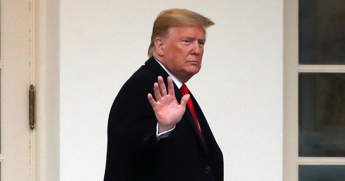 President Donald Trump waves as he walks along the West Wing Colonnade before departing from the White House on Jan. 13, 2020, in Washington, D.C.