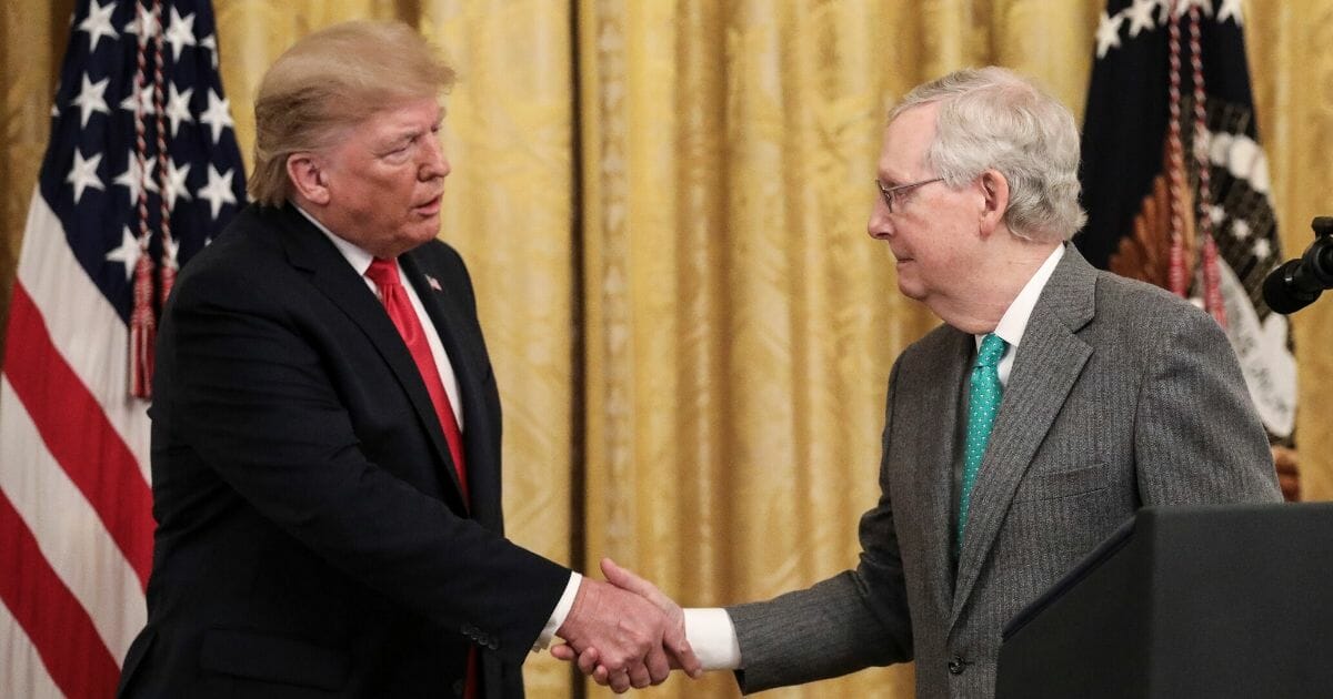 President Donald Trump shakes hands with Senate Majority Leader Mitch McConnell during an event about judicial confirmations in the East Room of the White House on Nov. 6, 2019, in Washington, D.C.