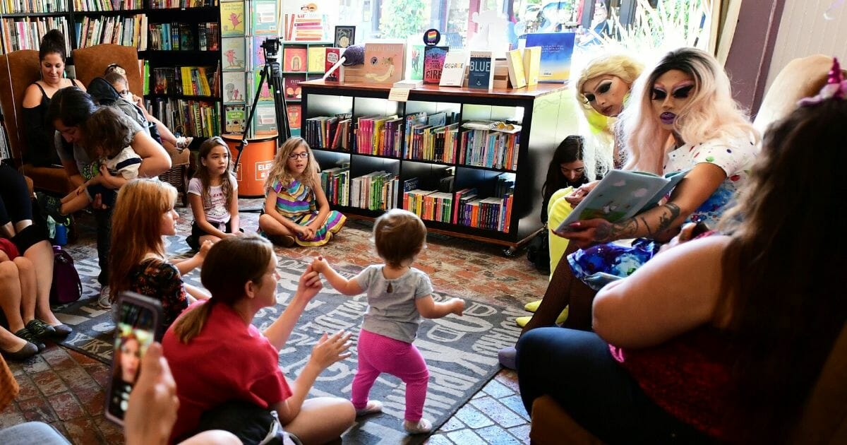 Two drag queens read to children gathered for Drag Queen Story Hour at Cellar Door Books in Riverside, California, on June 22, 2019.
