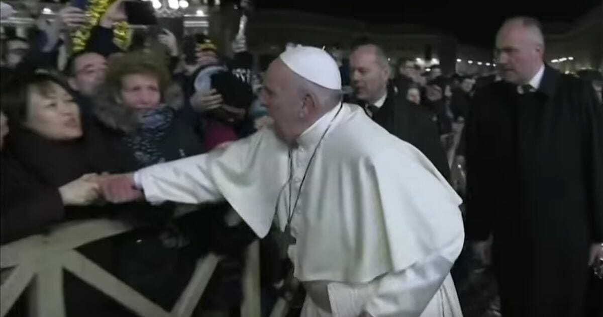 Pope Francis has apologized for slapping the arm of a woman who grabbed him on New Year's Eve.