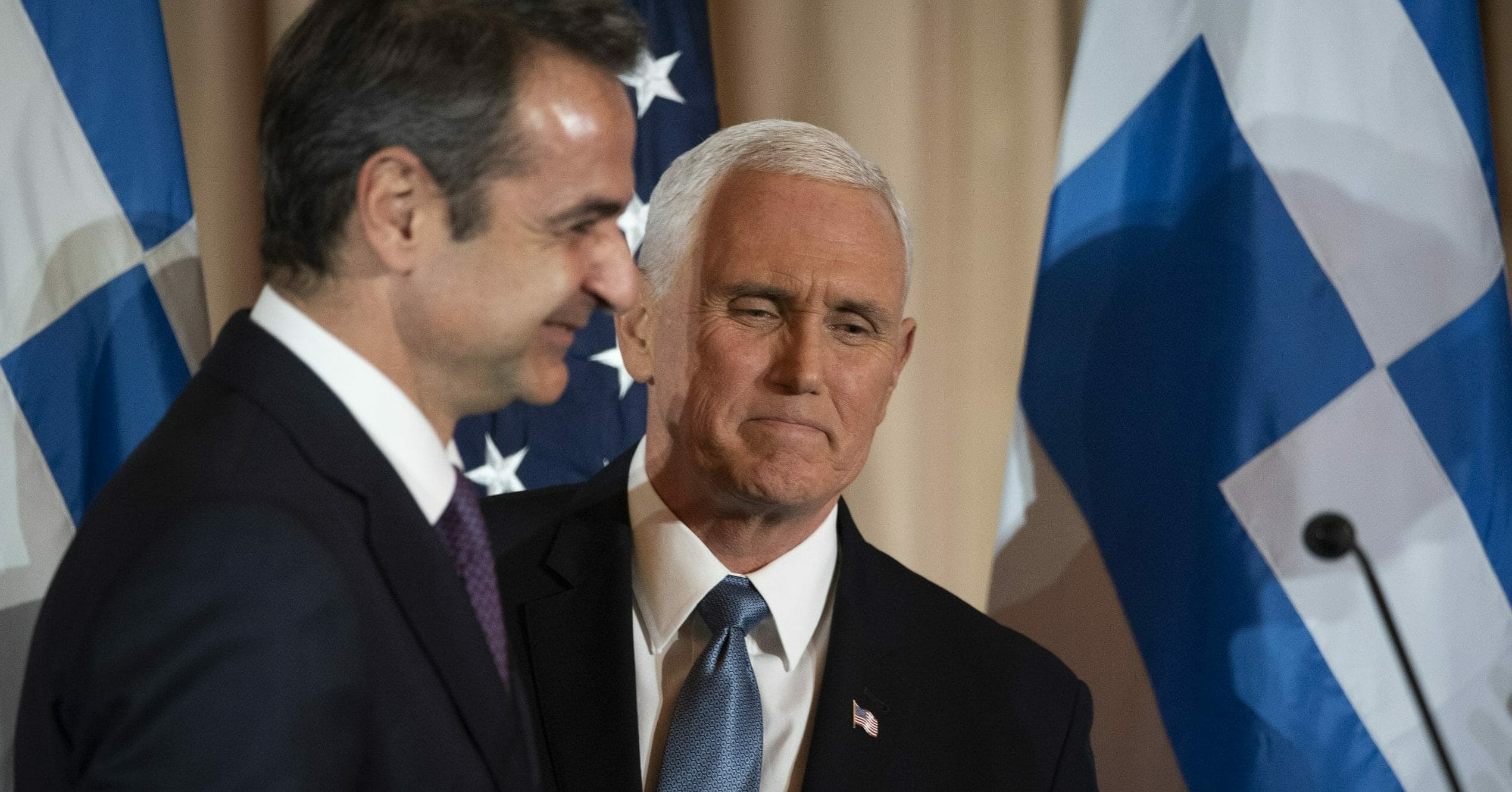Vice President Mike Pence, right, and Greek Prime Minister Kyriakos Mitsotakis appear at a reception at the State Department in Washington on Jan. 8, 2020.
