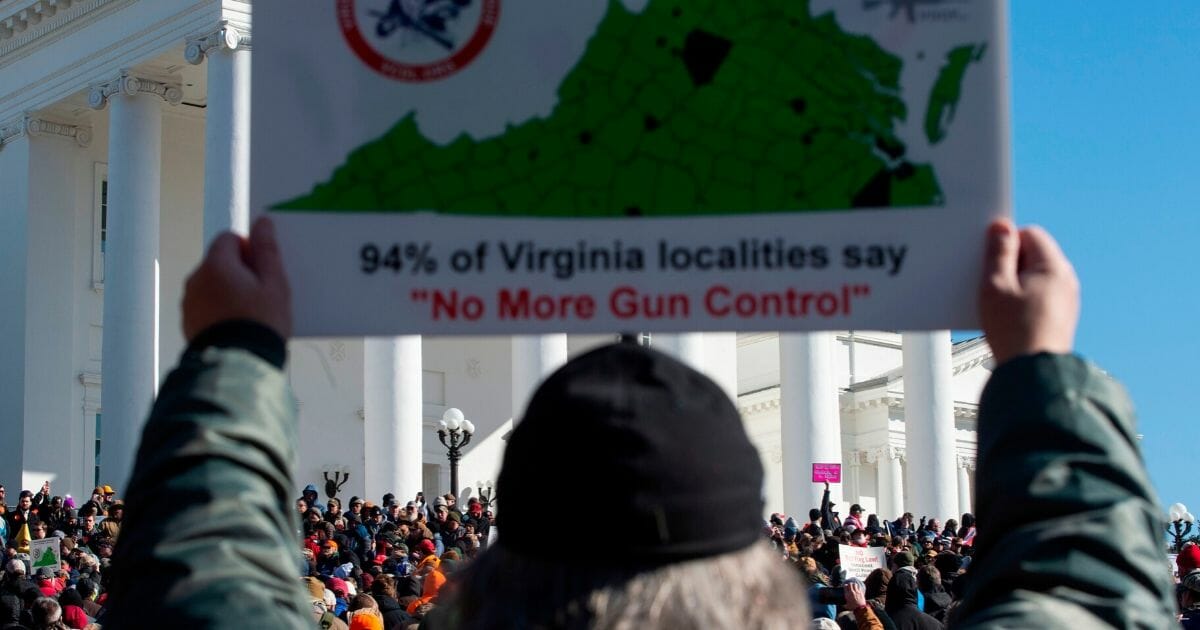 A pro-gun supporter holds a sign during a protest march on the grounds of the Virginia State Capitol in Richmond, Virginia, on Jan. 20, 2020.