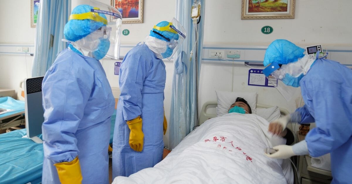 Medical workers are seen taking care of patients who have coronavirus pneumonia on Feb. 1, 2020, in Binzhou, Shandong, China.