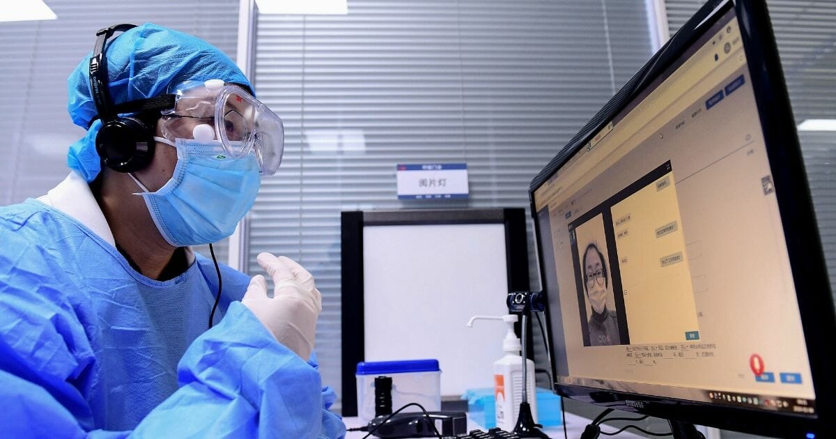 A doctor speaks with a patient during an online consultation session at a hospital in Shenyang in China's northeastern Liaoning province on Feb. 4, 2020, amid an outbreak of a deadly SARS-like virus which began in the city of Wuhan.