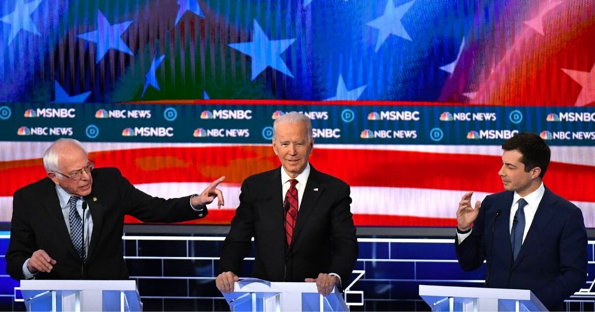 Democratic presidential candidates, from left, Vermont Sen. Bernie Sanders, former Vice President Joe Biden and former South Bend, Indiana, Mayor Pete Buttigieg take part in the ninth Democratic primary debate Feb. 19, 2020, at the Paris Theater in Las Vegas.