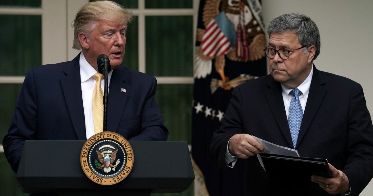 President Donald Trump, left, makes a statement on the census with Attorney General William Barr in the Rose Garden of the White House on July 11, 2019, in Washington, D.C.
