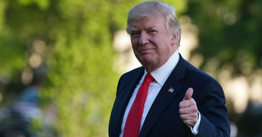 President Donald Trump makes his way across the South Lawn upon his return to the White House in Washington, D.C., on April 18, 2017, after visiting Wisconsin.