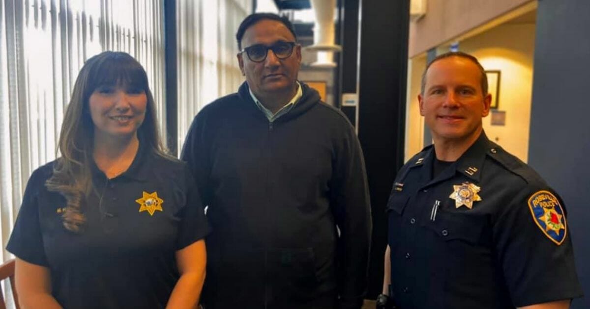 Cab driver Raj Singh with Roseville police officers.