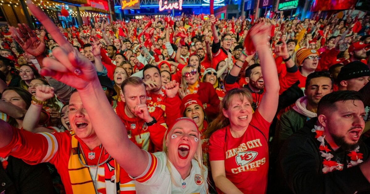 Fans cheer on the Chiefs at the Power and Light District as the Kansas City Chiefs play the San Francisco 49ers in the Super Bowl on Feb. 2, 2020, in Kansas City, Kansas.