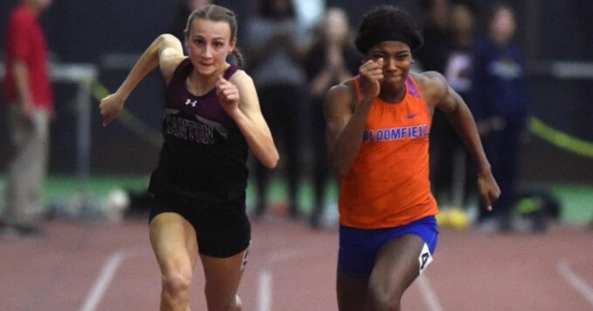 Canton senior Chelsea Mitchell edges out Terry Miller of Bloomfield to win the Class S girls 55-meter state championship.