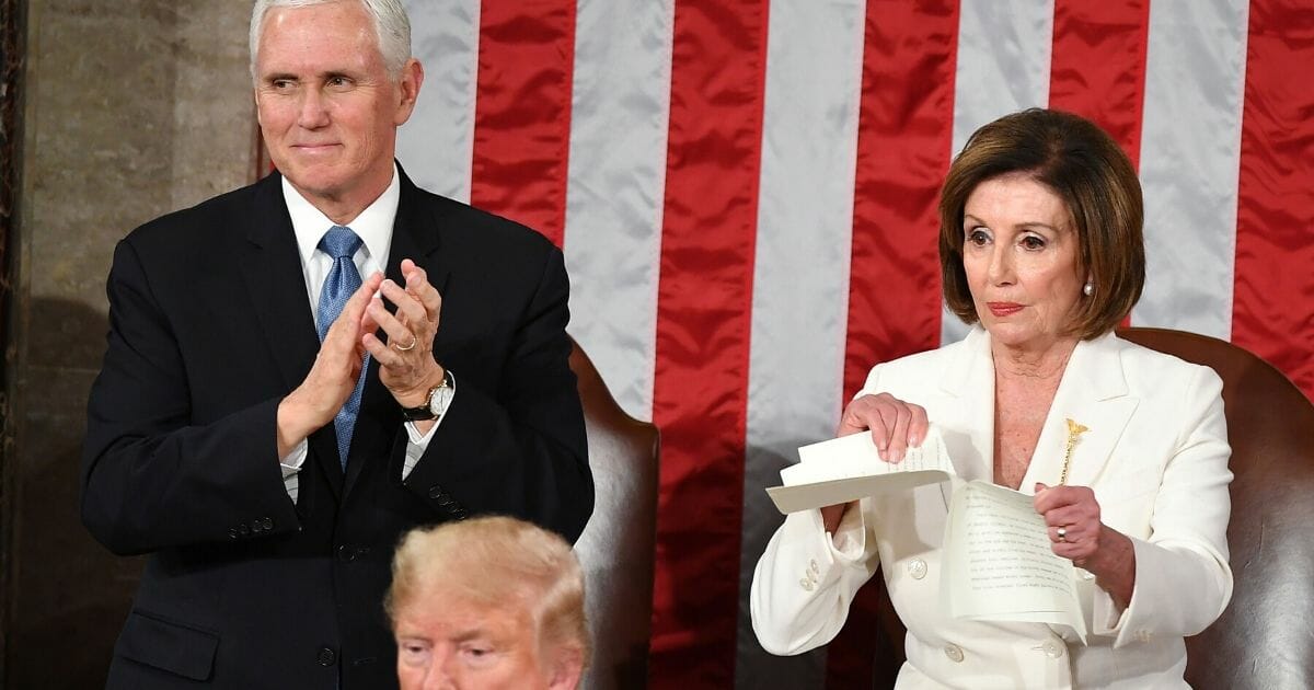 Speaker of the House Nancy Pelosi rips a copy of President Donald Trump's speech after he delivered the State of the Union address at the U.S. Capitol in Washington on Feb. 4, 2020.