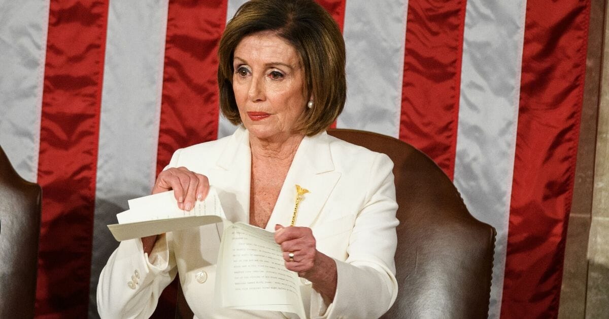 Speaker of the House Nancy Pelosi rips a copy of President Donald Trump's speech after he delivers the State of the Union address at the U.S. Capitol in Washington, D.C., on Feb. 4, 2020.