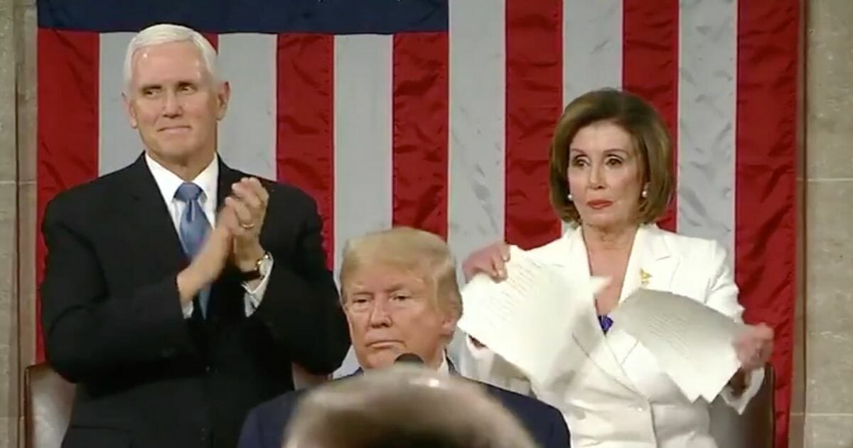 House Speaker Nancy Pelosi tears up her copy of President Donald Trump’s State of the Union Address at the U.S. Capitol following the conclusion of the president’s speech.